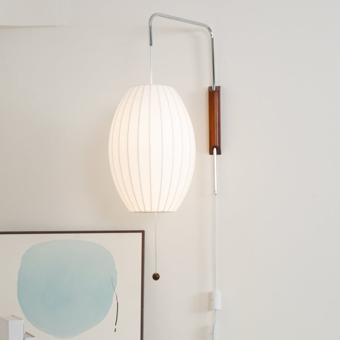 Ribbed Oval Wall Sconce With Pull Chain And Curved Arm
