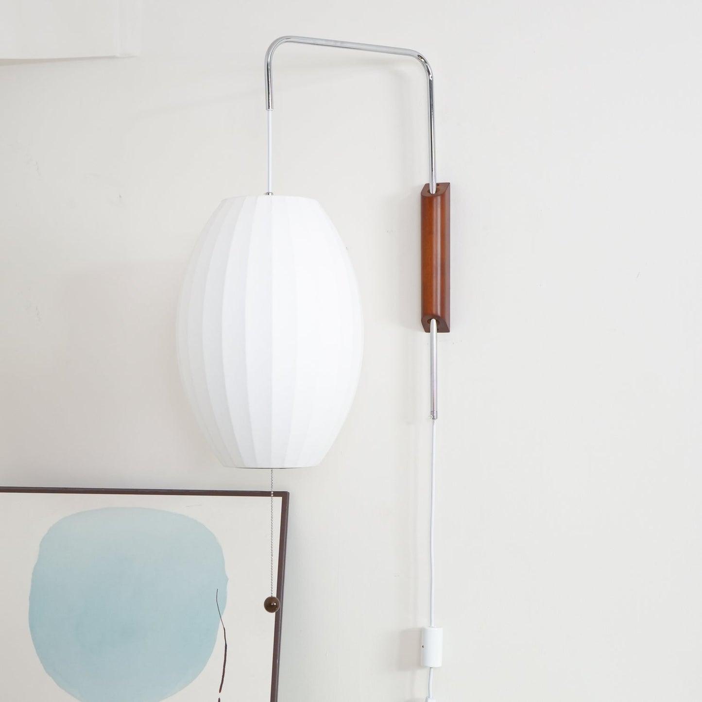 Ribbed Oval Wall Sconce With Pull Chain And Curved Arm