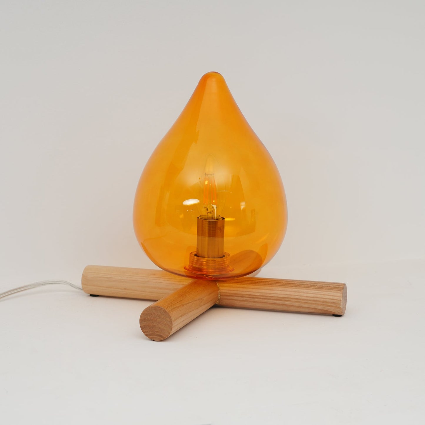 Flame-Inspired Glass Table Lamp With Wooden Cross Base