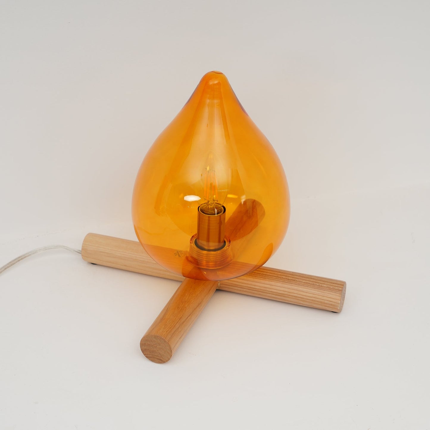 Flame-Inspired Glass Table Lamp With Wooden Cross Base