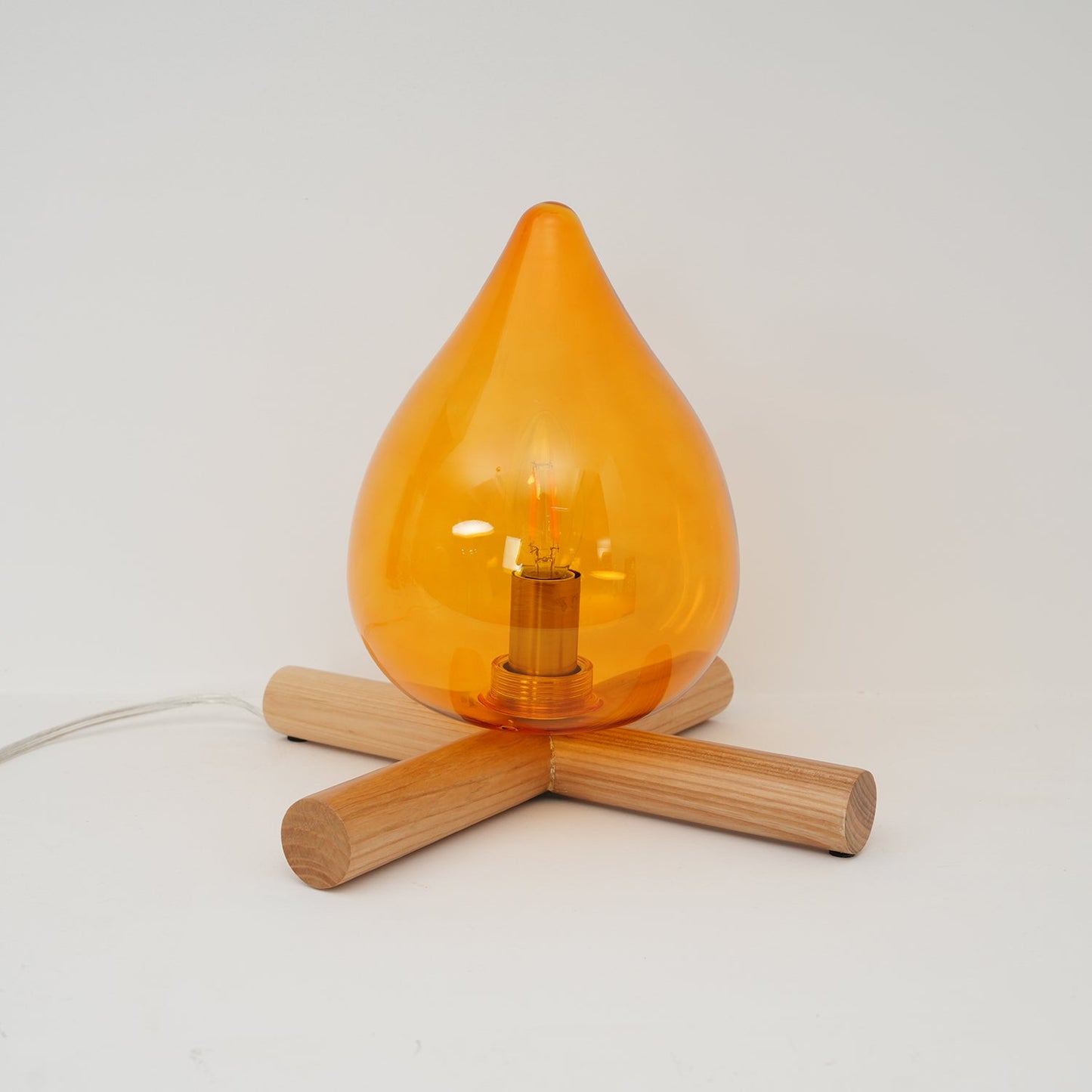 Flame-Inspired Glass Table Lamp With Wooden Cross Base