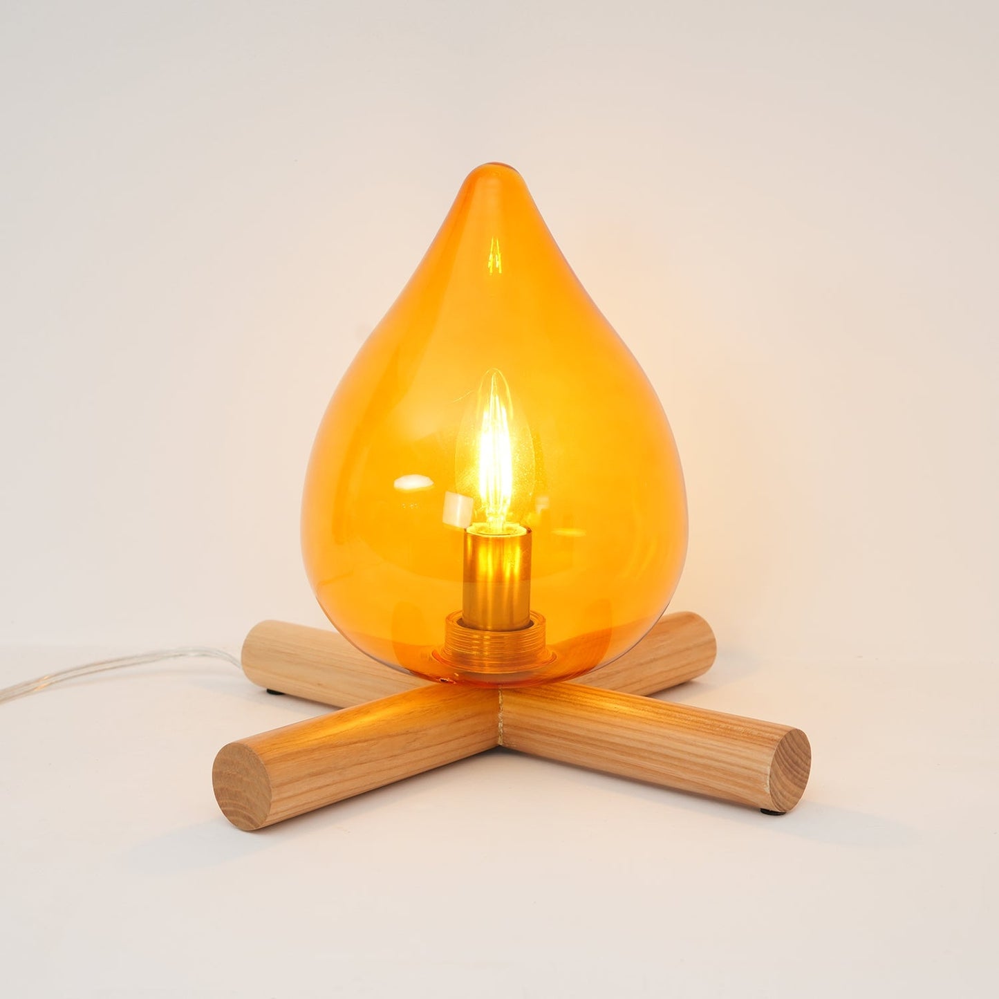 Flame-Inspired Glass Table Lamp With Wooden Cross Base