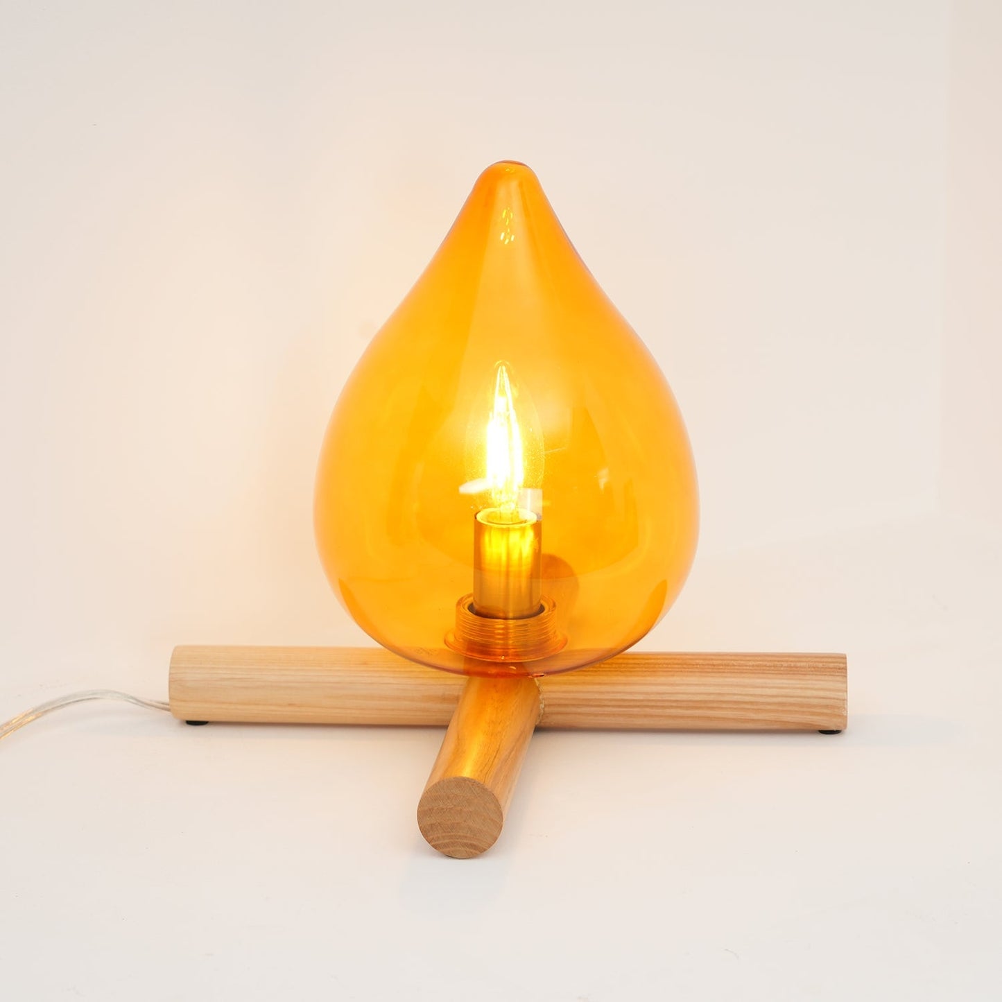 Flame-Inspired Glass Table Lamp With Wooden Cross Base