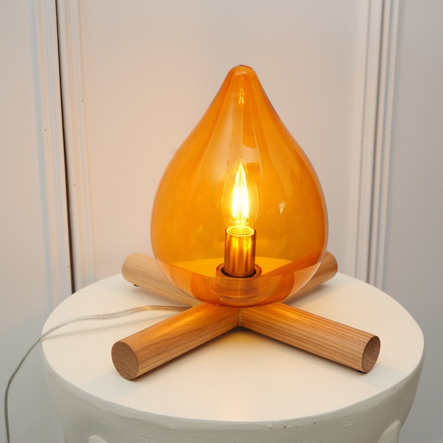 Flame-Inspired Glass Table Lamp With Wooden Cross Base