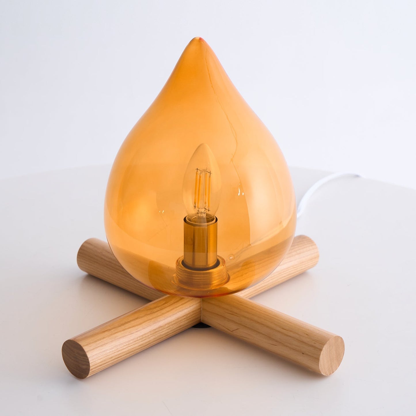 Flame-Inspired Glass Table Lamp With Wooden Cross Base