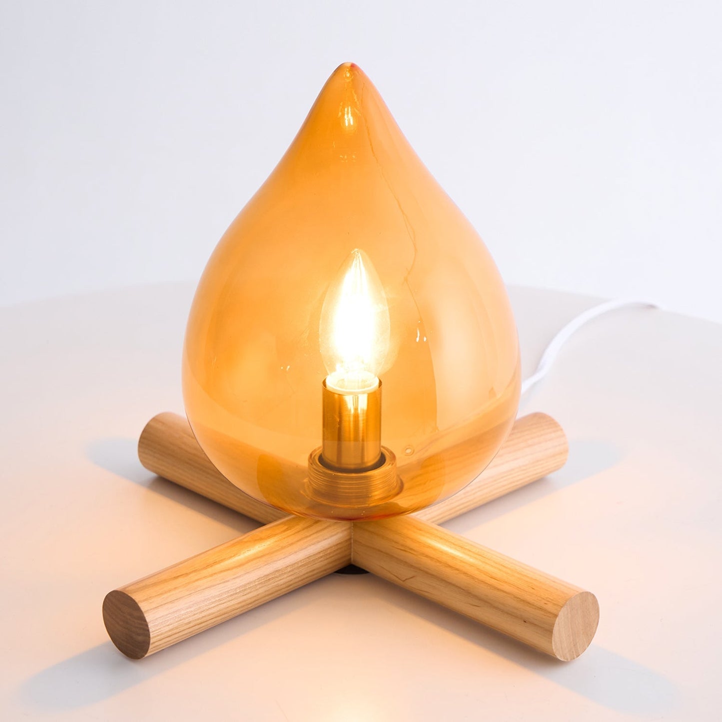 Flame-Inspired Glass Table Lamp With Wooden Cross Base