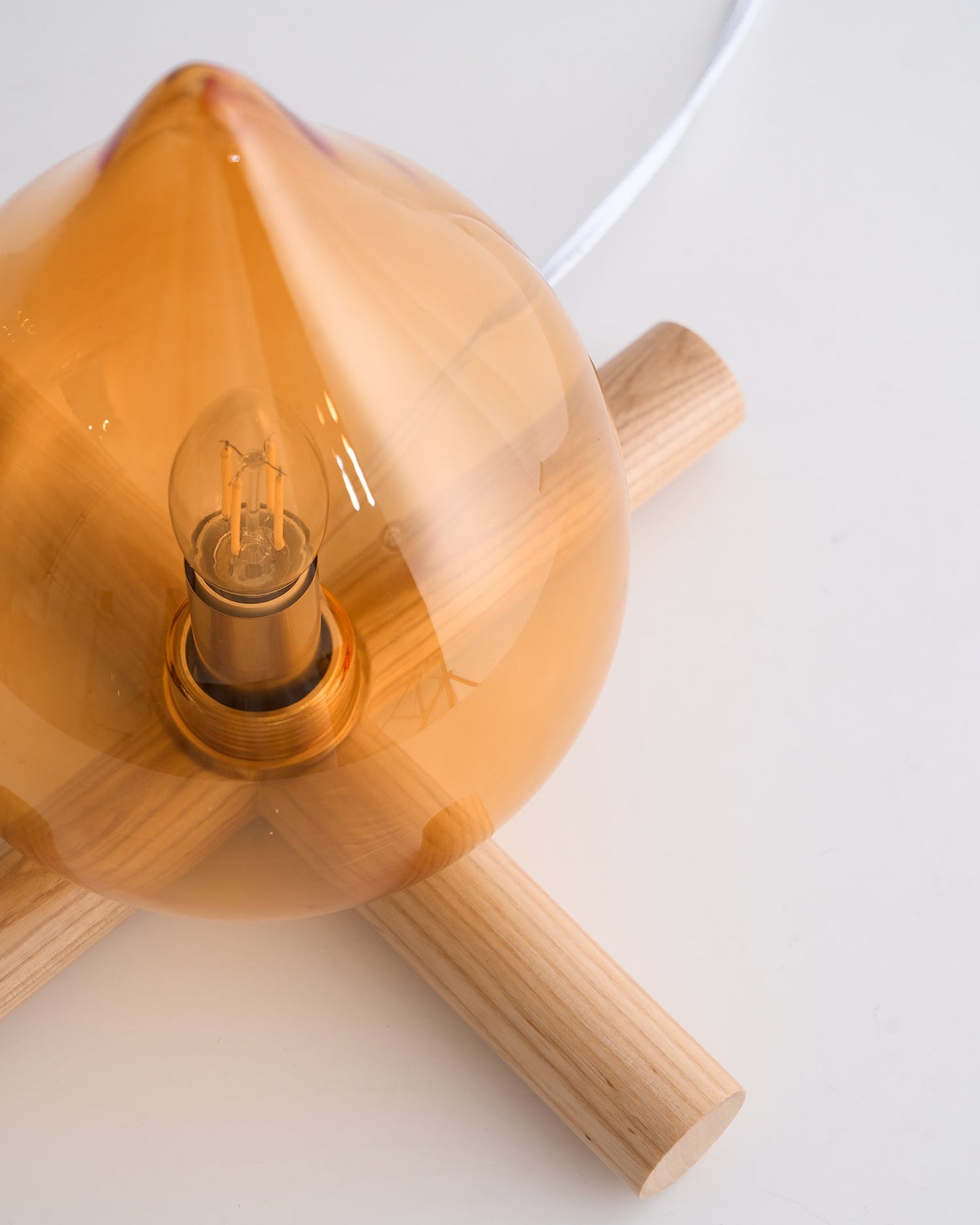 Flame-Inspired Glass Table Lamp With Wooden Cross Base