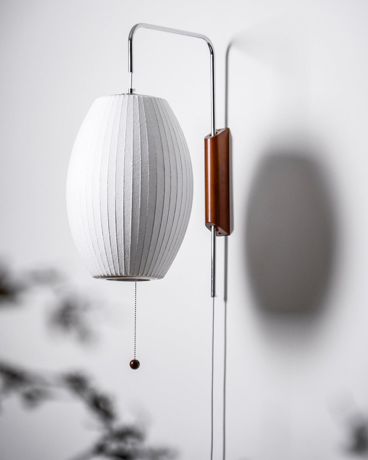 Ribbed Oval Wall Sconce With Pull Chain And Curved Arm