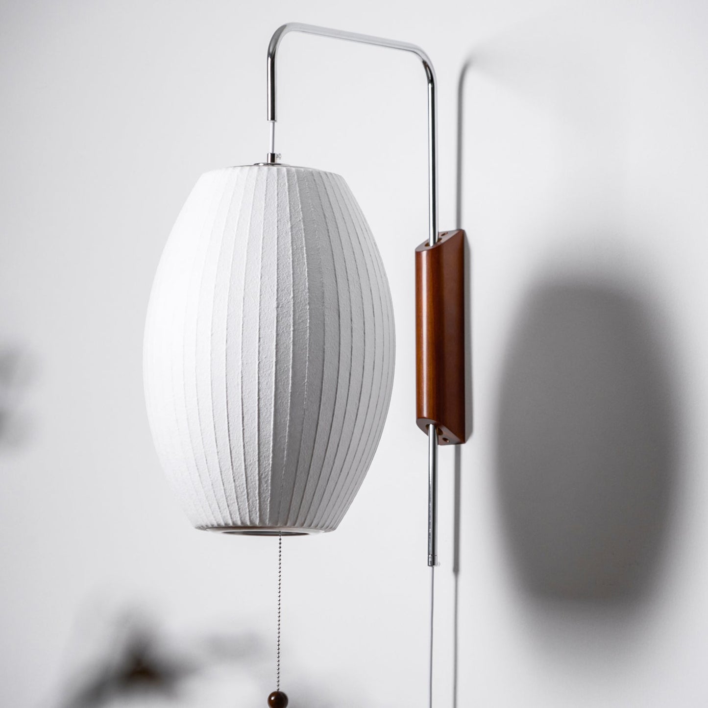 Ribbed Oval Wall Sconce With Pull Chain And Curved Arm