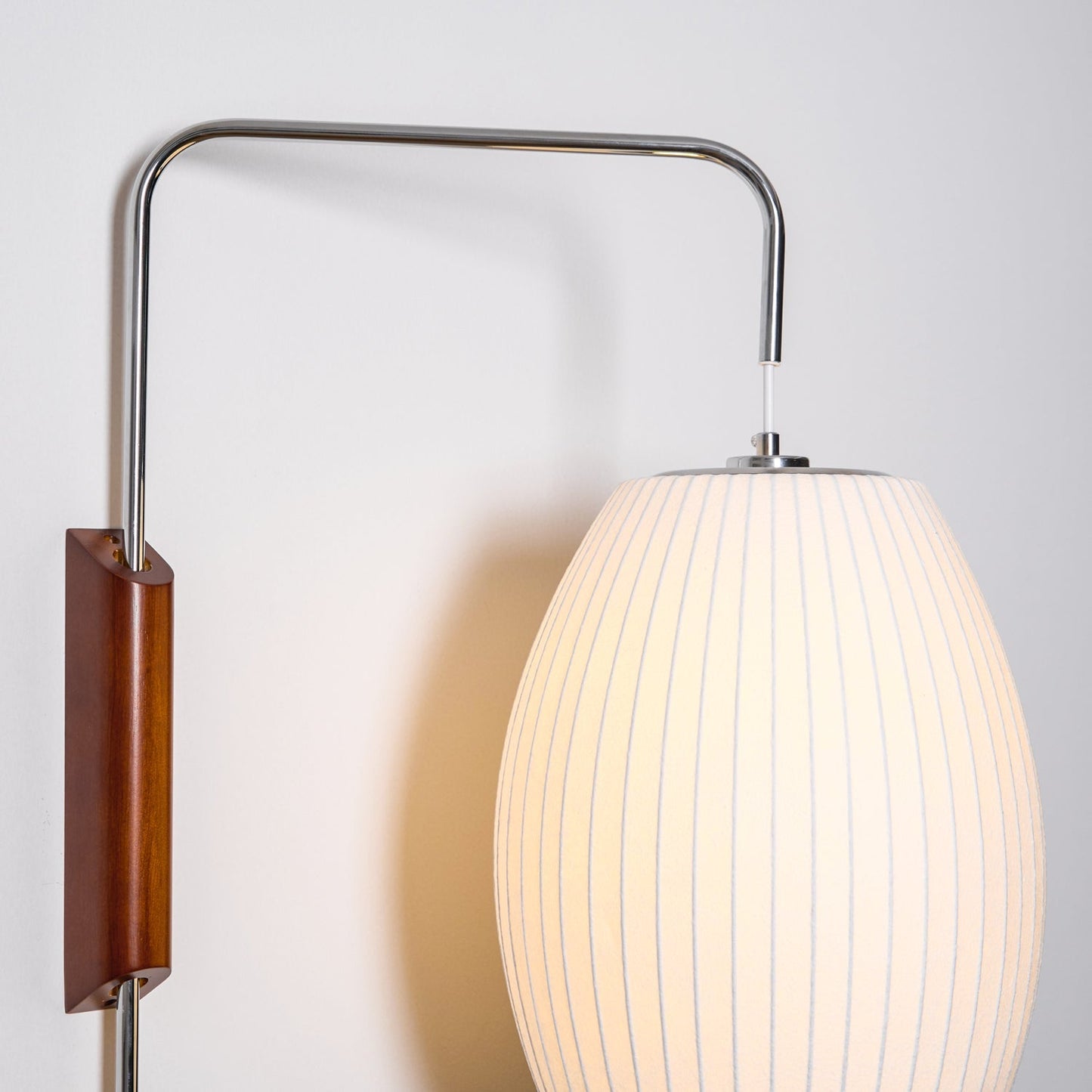 Ribbed Oval Wall Sconce With Pull Chain And Curved Arm