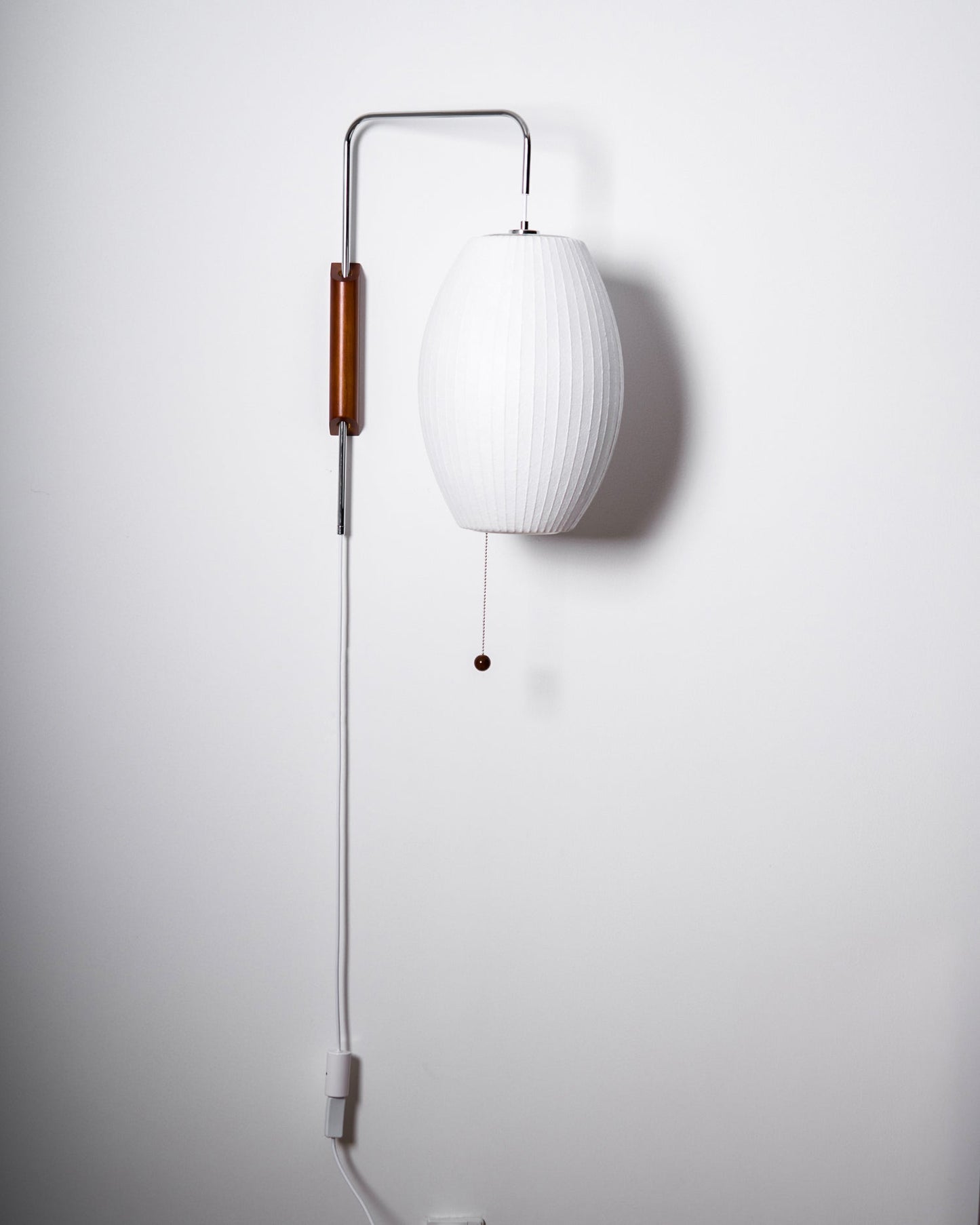 Ribbed Oval Wall Sconce With Pull Chain And Curved Arm
