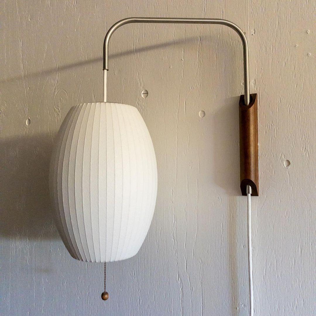 Ribbed Oval Wall Sconce With Pull Chain And Curved Arm