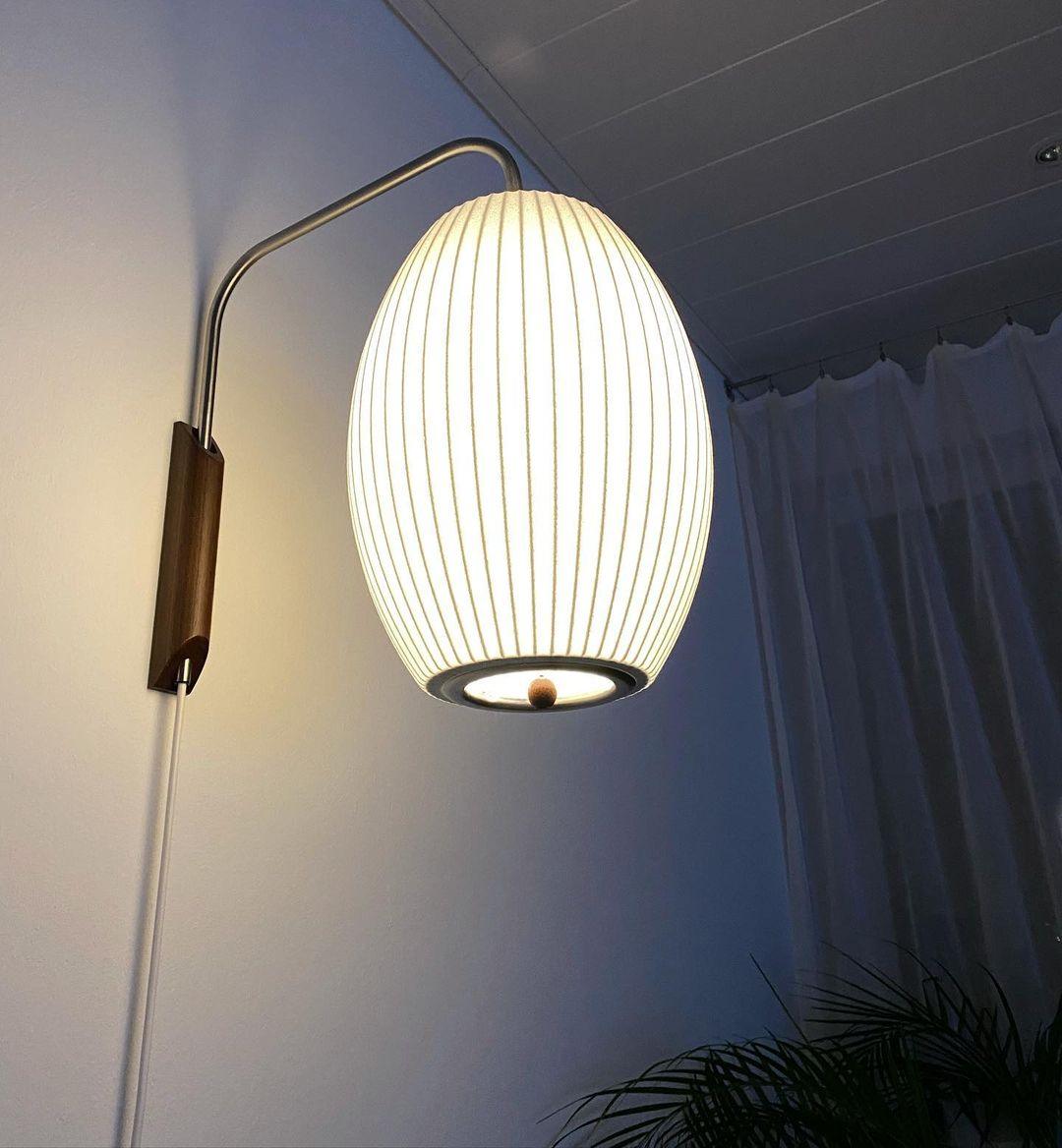 Ribbed Oval Wall Sconce With Pull Chain And Curved Arm