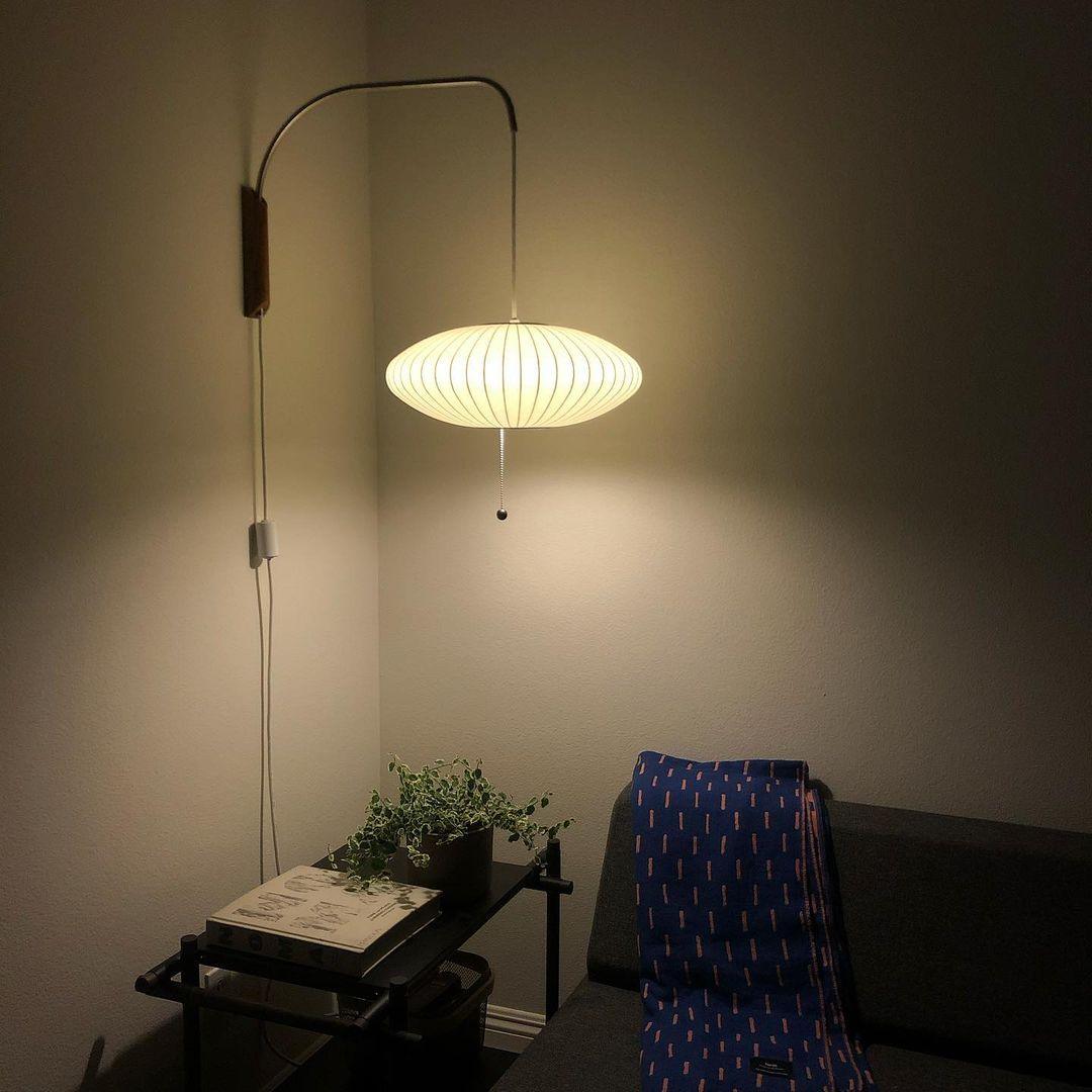 Ribbed Oval Wall Sconce With Pull Chain And Curved Arm