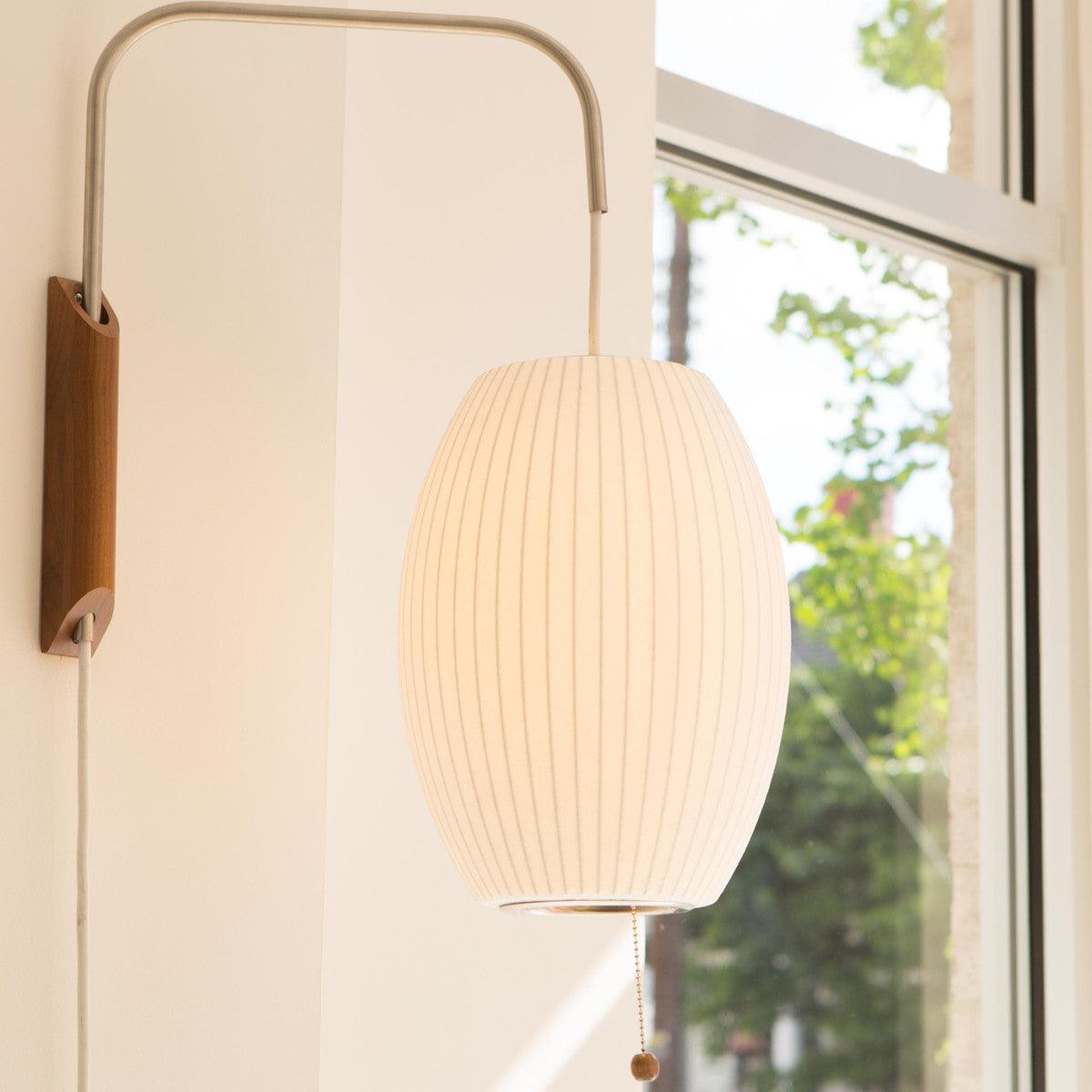 Ribbed Oval Wall Sconce With Pull Chain And Curved Arm
